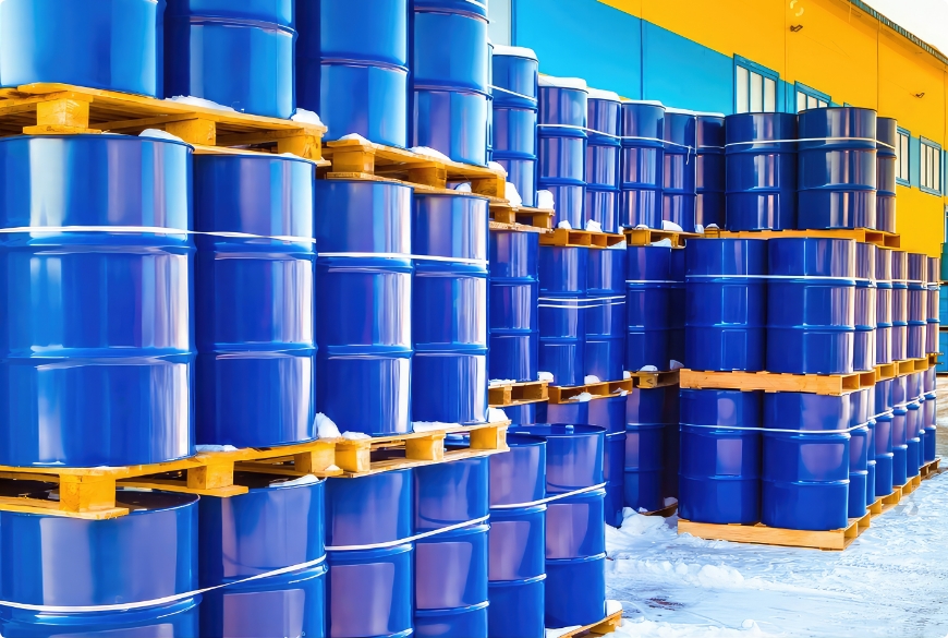 stock-photo-plastic-containers-palletized-near-the-stock-barrels-for-toxic-substances-chemical-storage-tanks